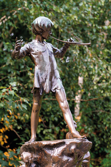 EDAWAN LONDON, UK - September 23, 2014: Peter Pan statue in Kensington Gardens, London